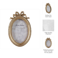 Gold Polyresin Oval Coquette with Bow, 4x6 in.
